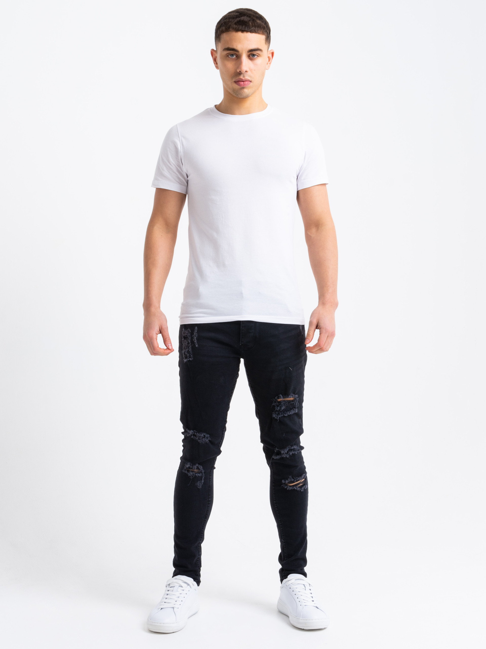 Black ripped jeans top and white shirt